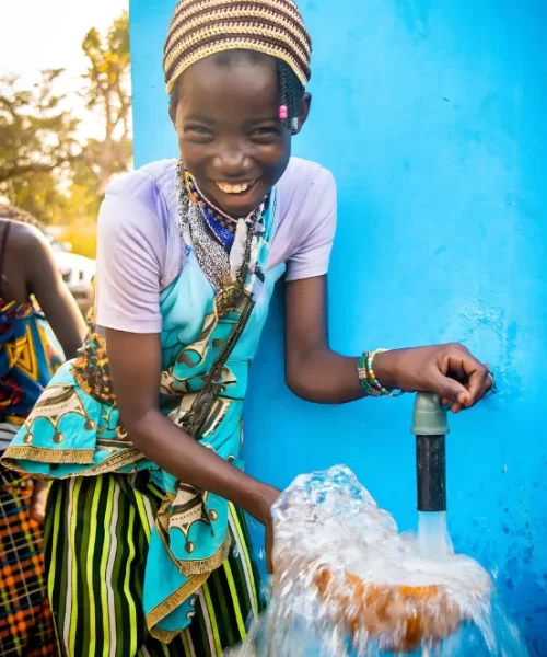 Happy Young Girl Collects Clean Drinking Water Happy Young Girl Collects Clean Drinking Water
